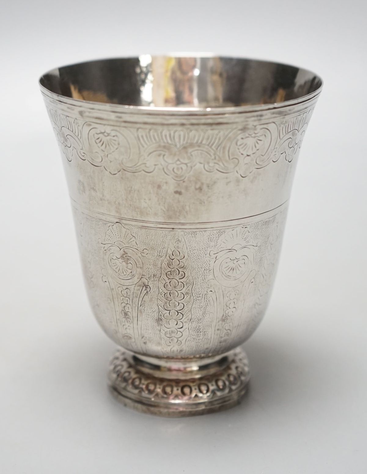 A 19th century French or Swiss engraved white metal beaker, 97mm, 90 grams.